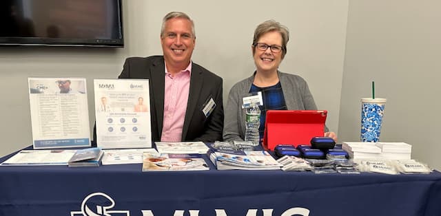 MLMIC team members sitting at a table