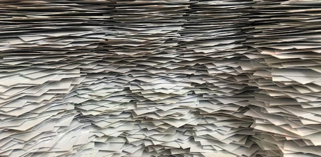 piles of paper depicting destroying paper medical records