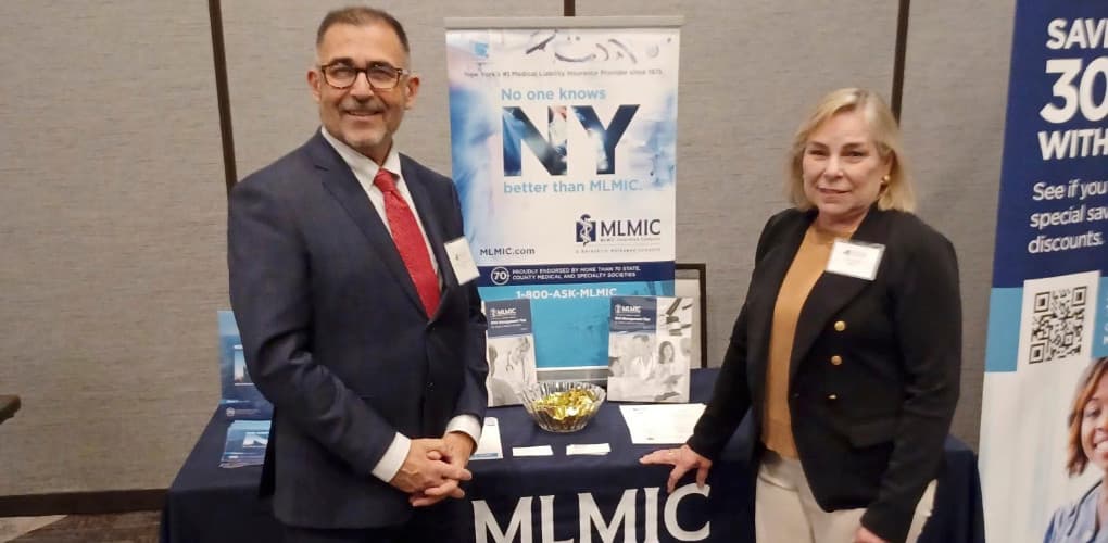 MLMIC team at booth depicting September 2023 events for New York physicians