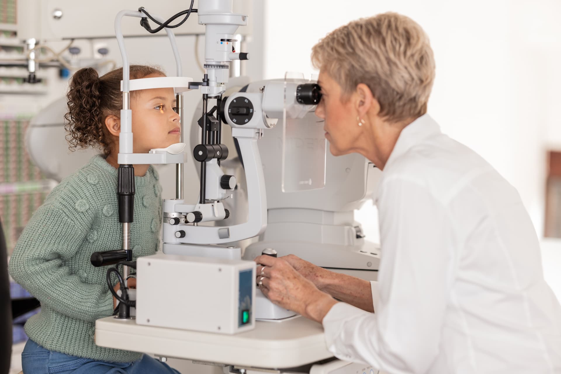 child receiving a vision eye exam