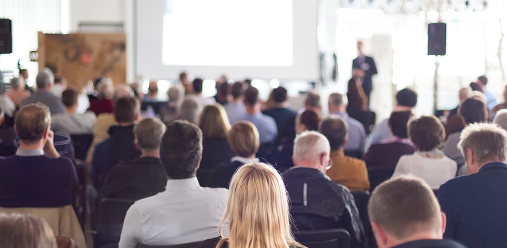Image shows a group of people at a meeting